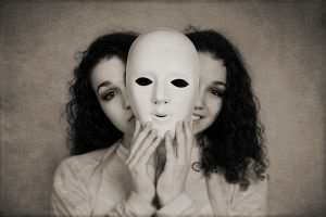 two-faced happy sad woman manic depression or schizophrenia concept with vintage filter