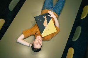 man lying paint