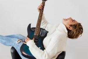 woman playing guitar