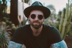 man wearing sun glasses and hat